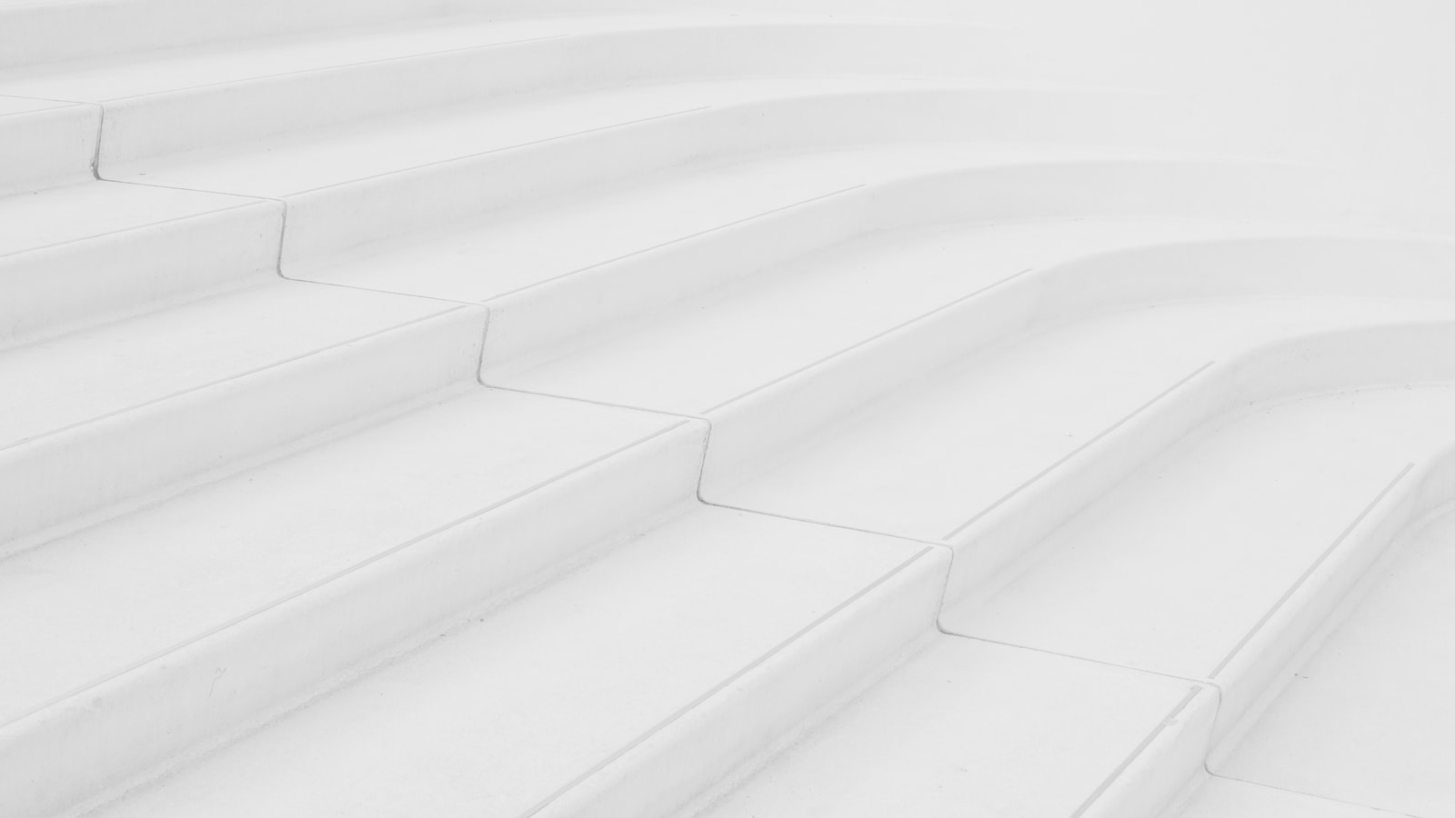 Broad white concrete steps rising in even increments